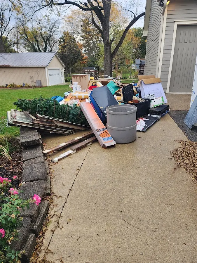 Dumpster being loaded with debris for Residential Dumpster Rental in Wadesboro